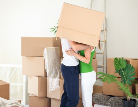 Customer moving items carefully in a storage corridor with safety awareness